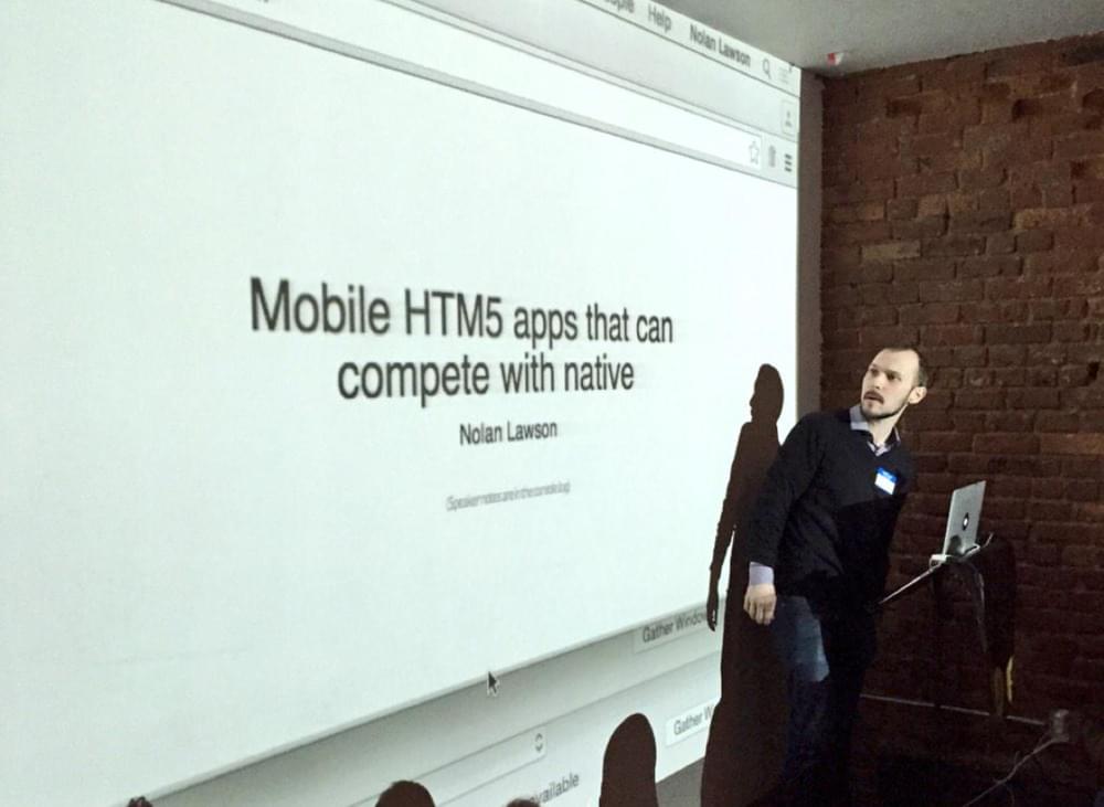 Picture of the author in front of a projection saying Mobile HTML5 apps that can compete with native